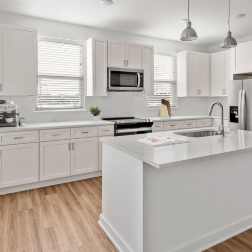 Refined spaces to match your style a kitchen with white cabinets