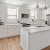 a kitchen with white cabinets