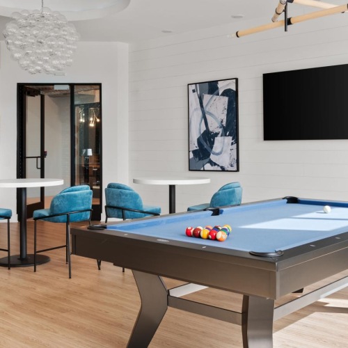 Access to resident-only features a room with a pool table and chairs