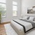 a bedroom with a bed and a tv